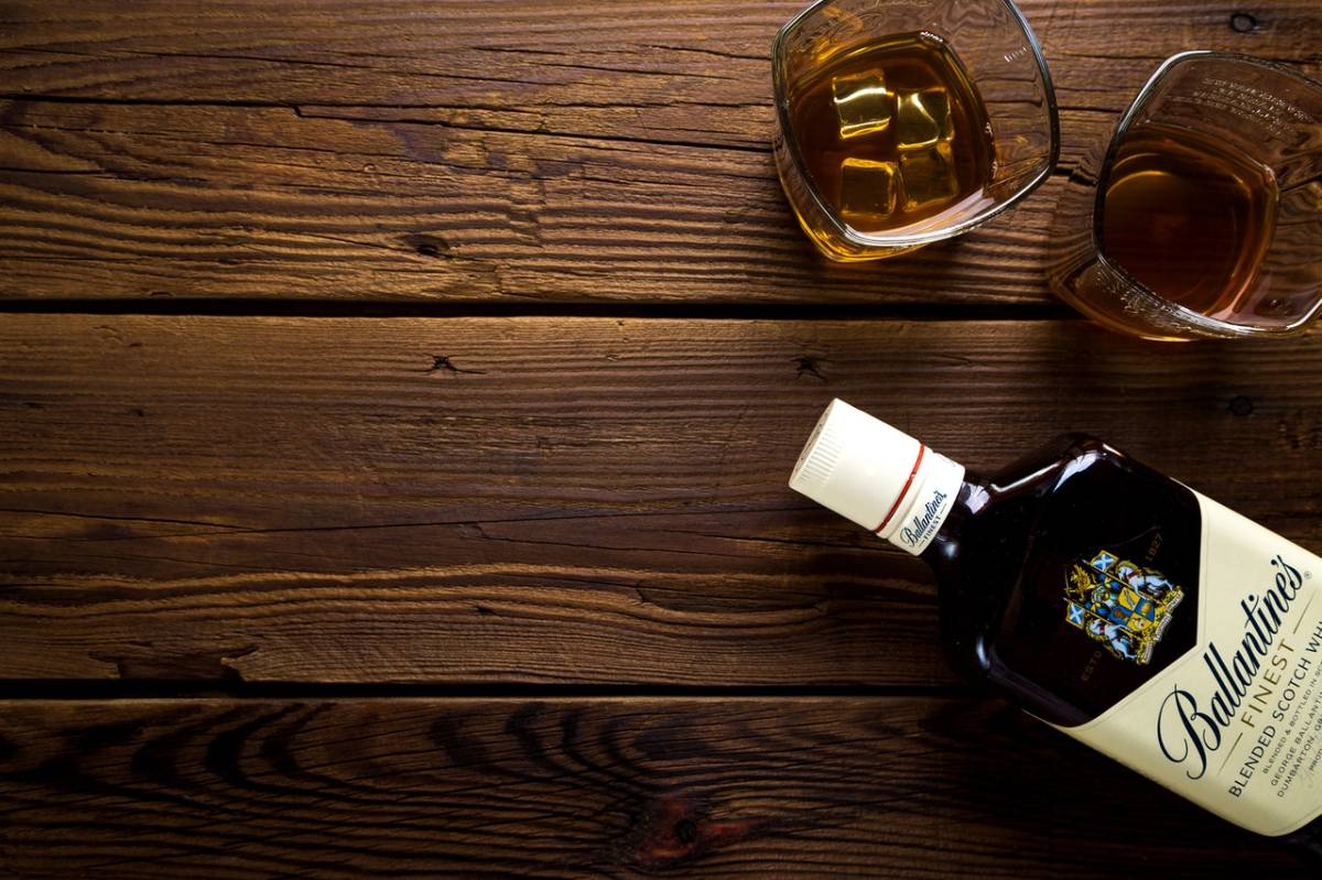 scotch and glasses on a table